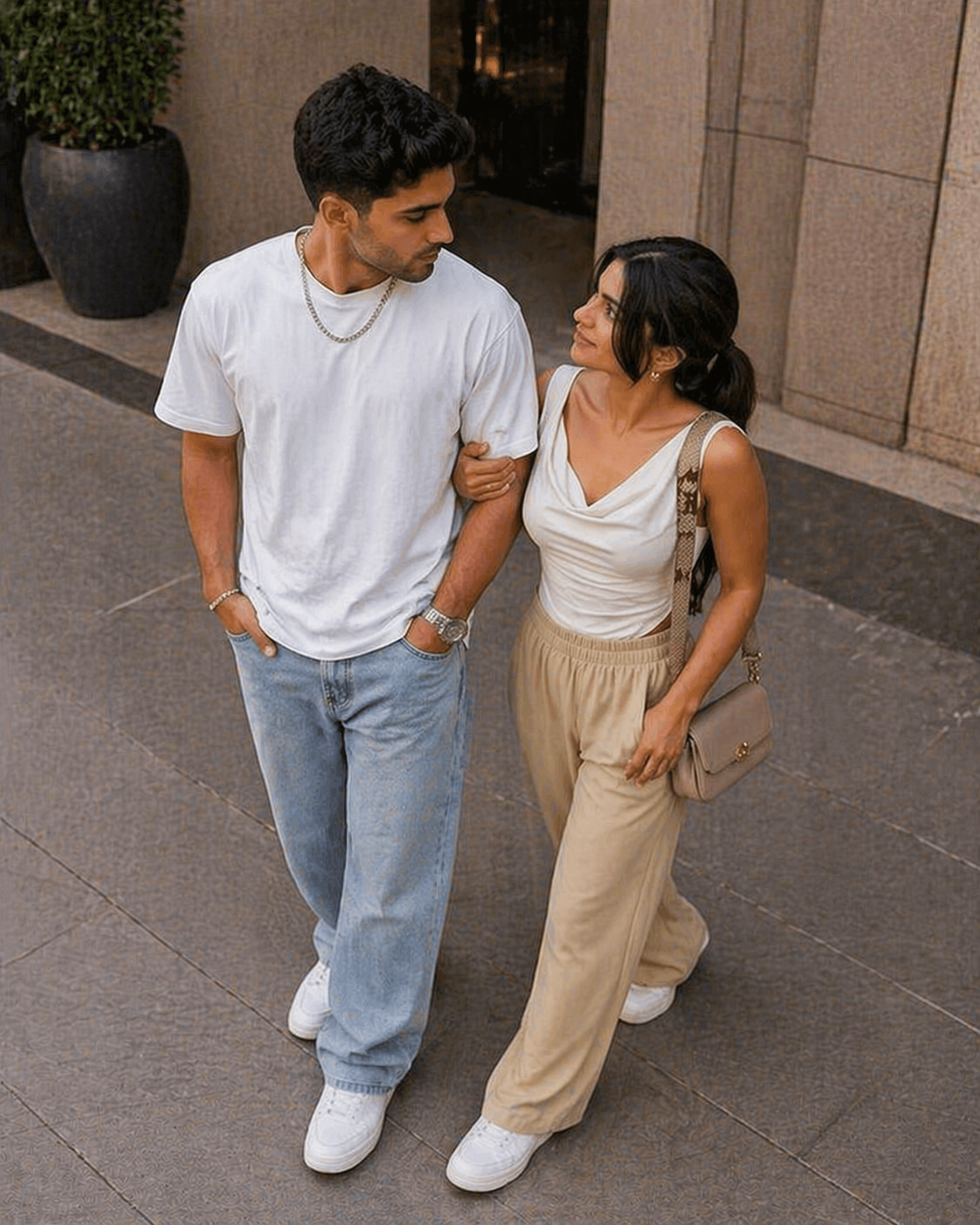 Accessories detail: silver watch, gold hoops, and crescent bag